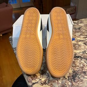 Rothy’s lace up sneaker.  The color is lighthouse